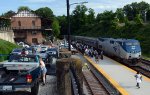 One lady unaware of how short tr. 66 is makes her way down the platform.  Train is only five cars long, compared to the eight or nine cars the morning Regional sports.  A 180 turn was made.